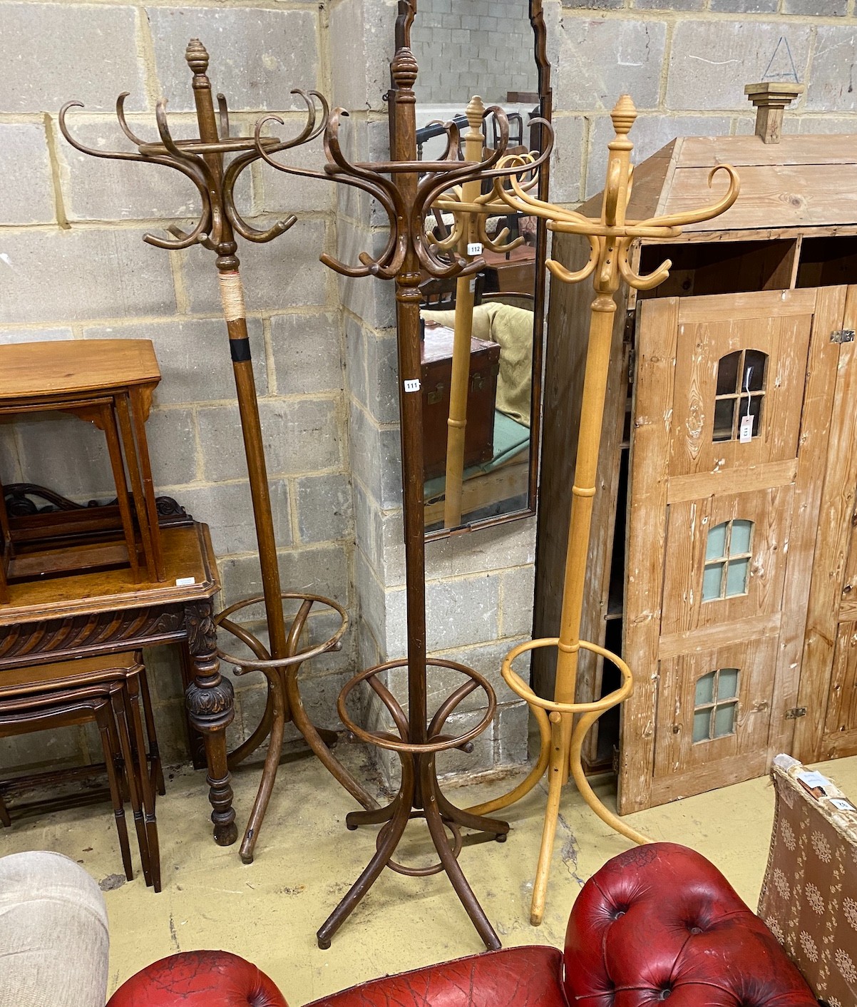 Three bentwood coat stands, largest height 192cm